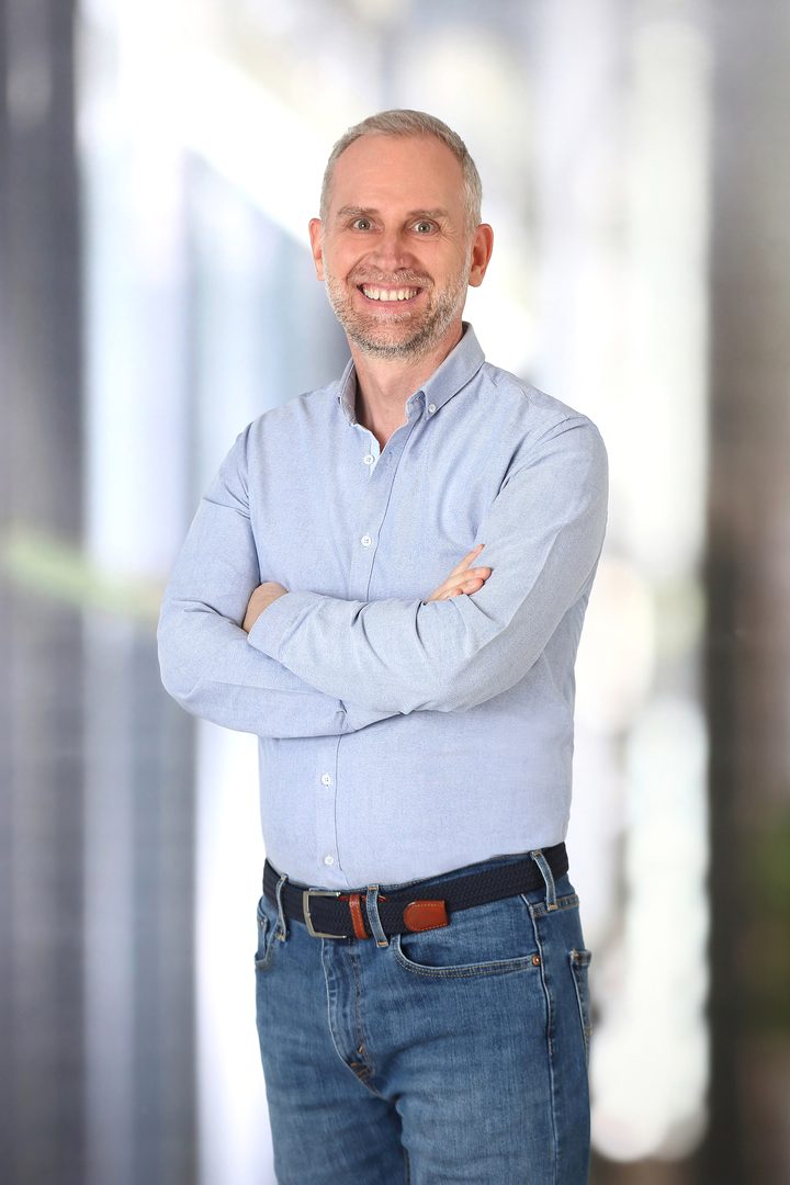 Johannes Geyer standing and smiling